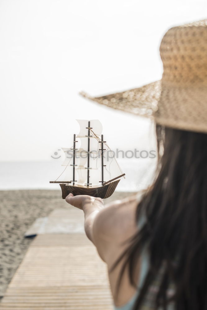 Similar – Image, Stock Photo Little boy on a dock sitting on his back looking to the ocean