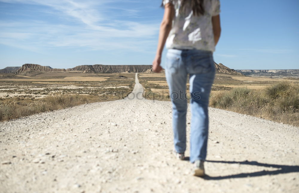 Similar – Image, Stock Photo Woman with backpack walking on the road