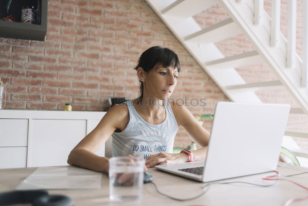 Similar – Young businesswoman working on laptop and drinking coffee