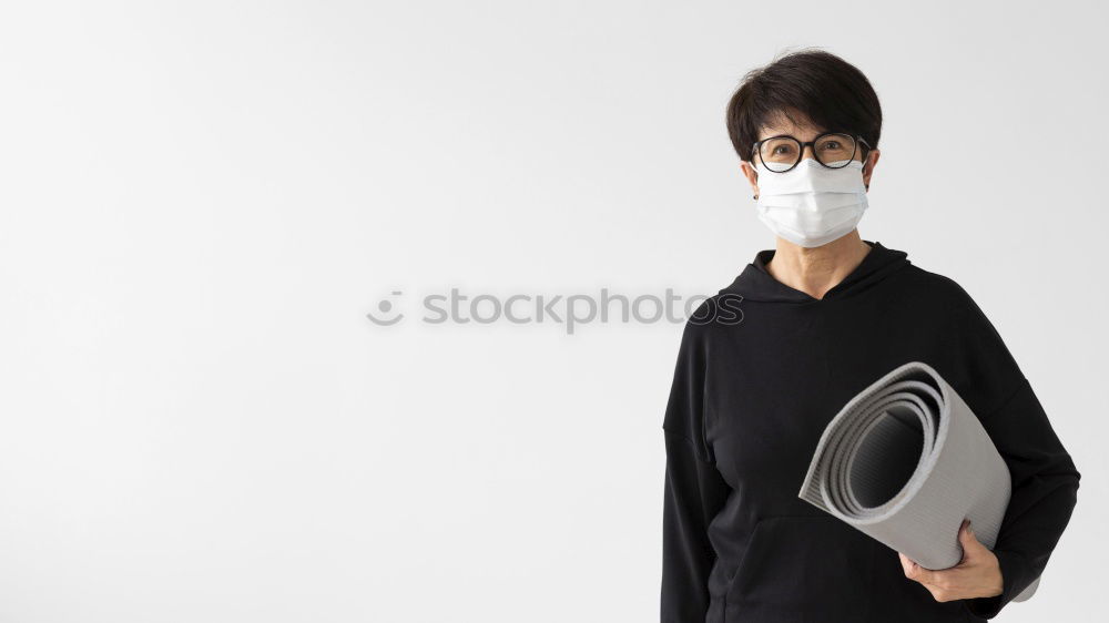 Similar – Man with facial mask and sunglasses looking at camera