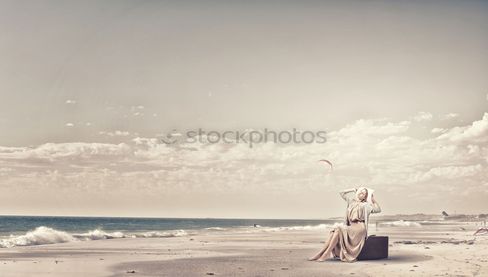 Similar – lonely couple walking on the beach