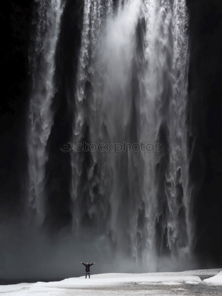 Waterfall on Iceland with man