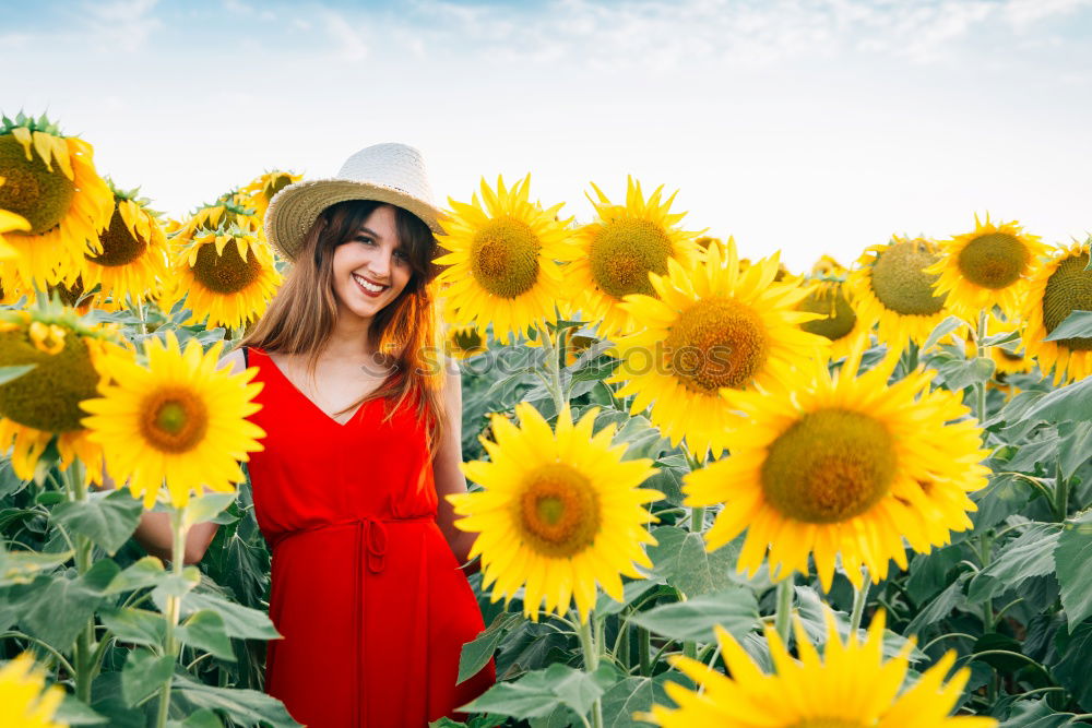 Similar – Image, Stock Photo Happy young black woman walking in a sunflower field