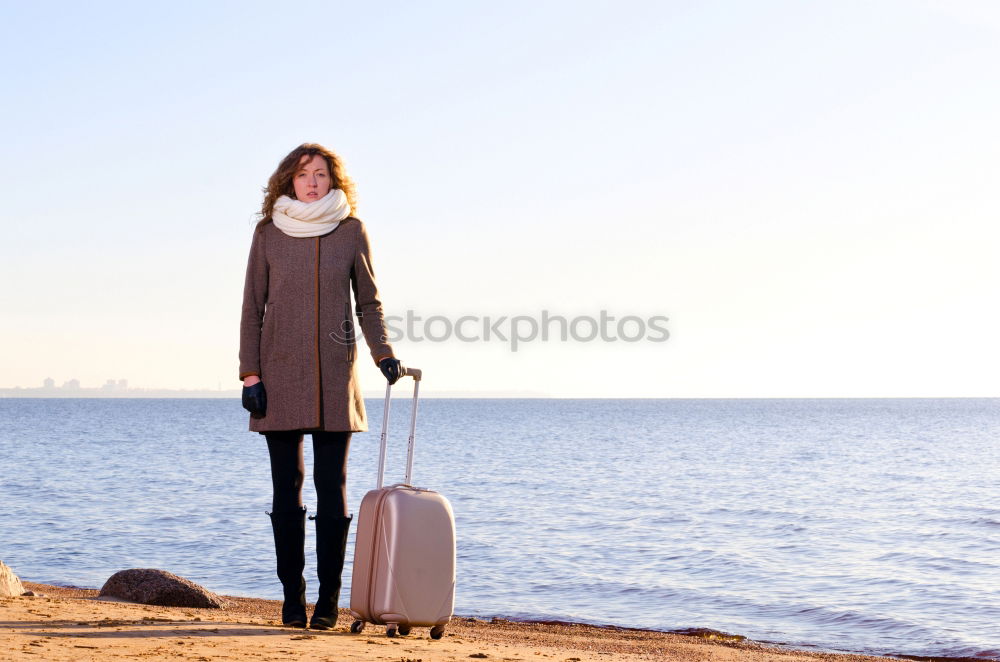 Similar – Woman on the beach in winter