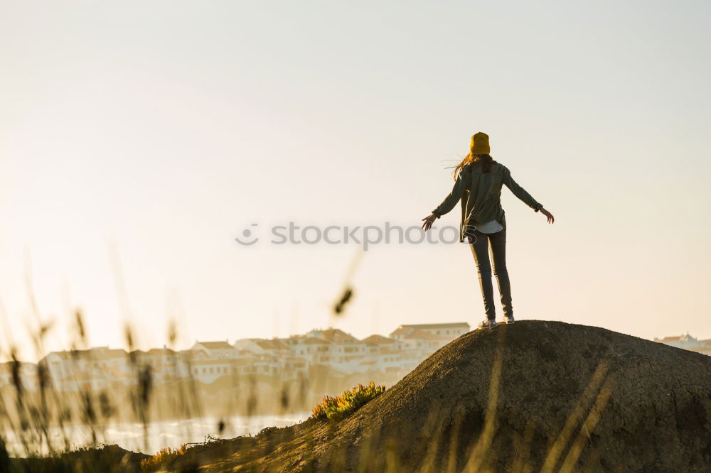 Similar – Man posing with skateboard in evening