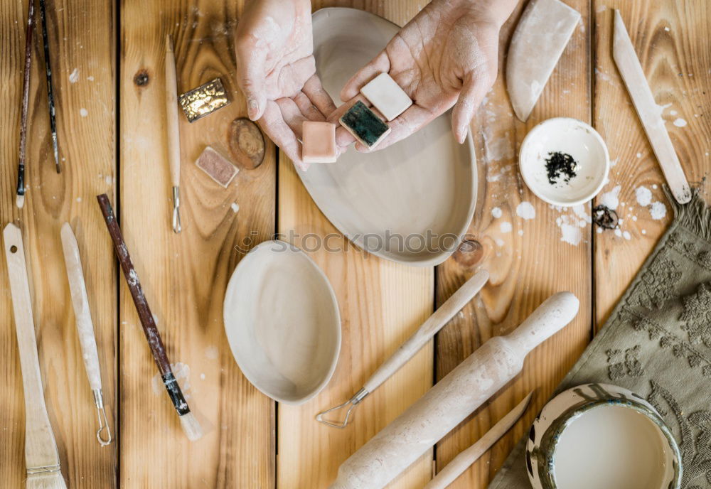 Similar – Hands of woodcarver make ??wooden bowl