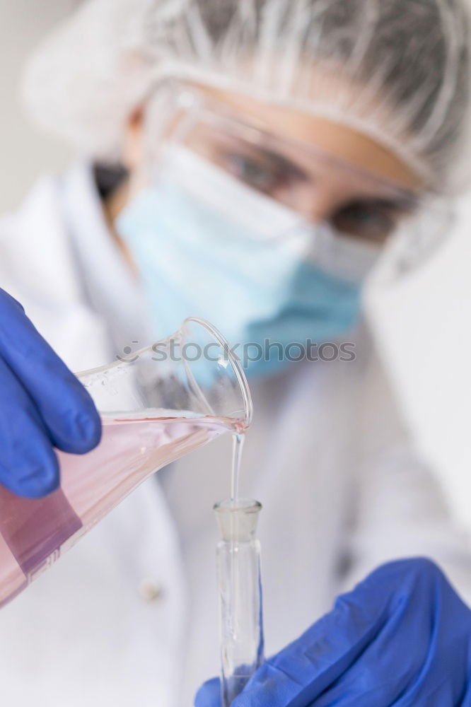 Similar – Worker putting liquid to test tube