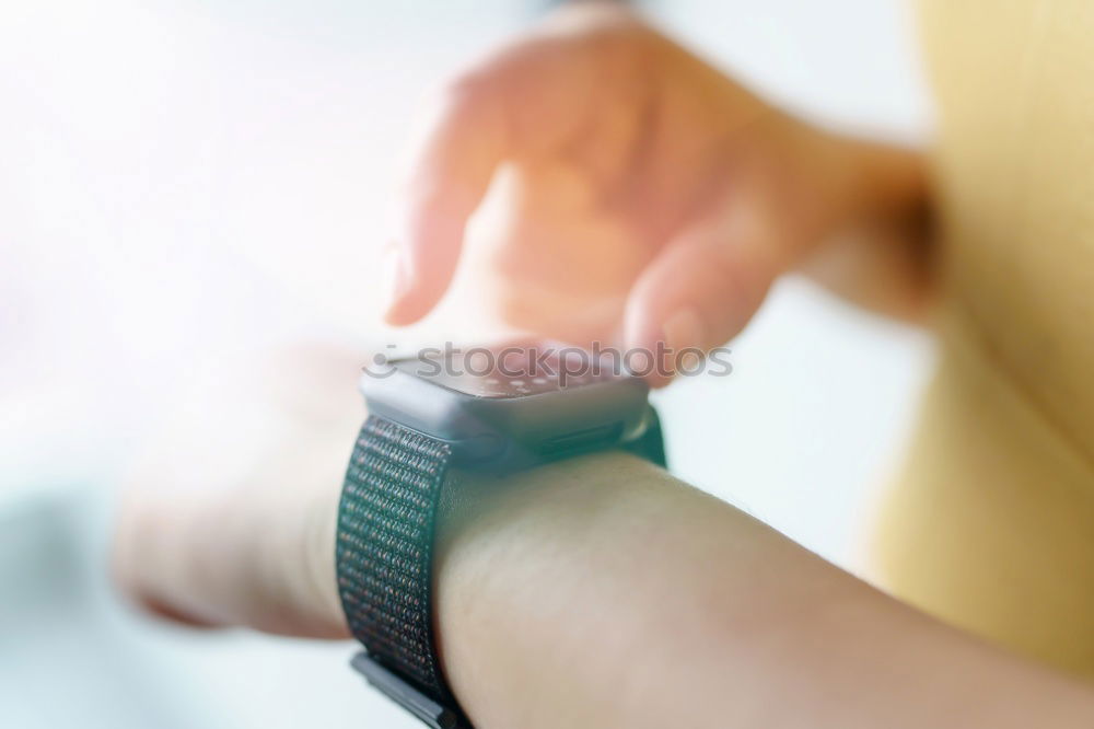 Similar – Woman using smartwatch touching touchscreen