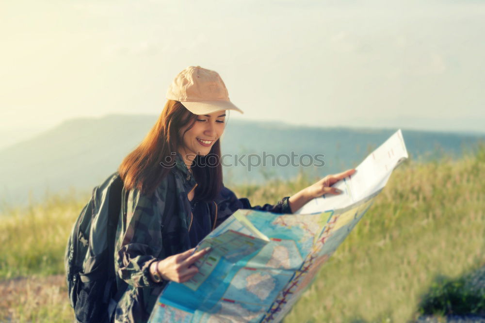 Similar – Image, Stock Photo Young hiking woman taking notes in the nature