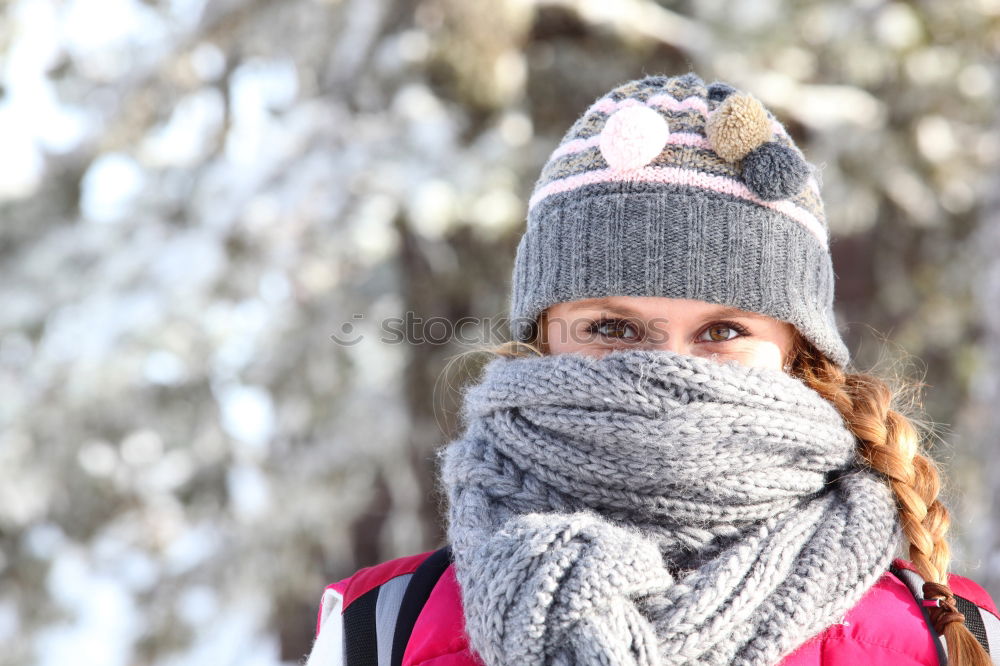 Similar – Young woman wrapped warm against the cold