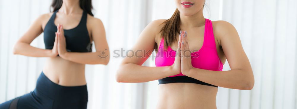 Similar – Group of young sporty attractive women in yoga studio, practicing yoga lesson with instructor, standing, stretching and relaxing after workout . Healthy active lifestyle, working out indoors in gym