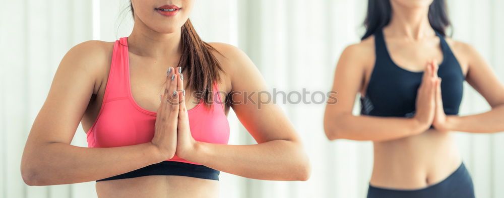 Similar – Group of young sporty attractive women in yoga studio, practicing yoga lesson with instructor, standing, stretching and relaxing after workout . Healthy active lifestyle, working out indoors in gym