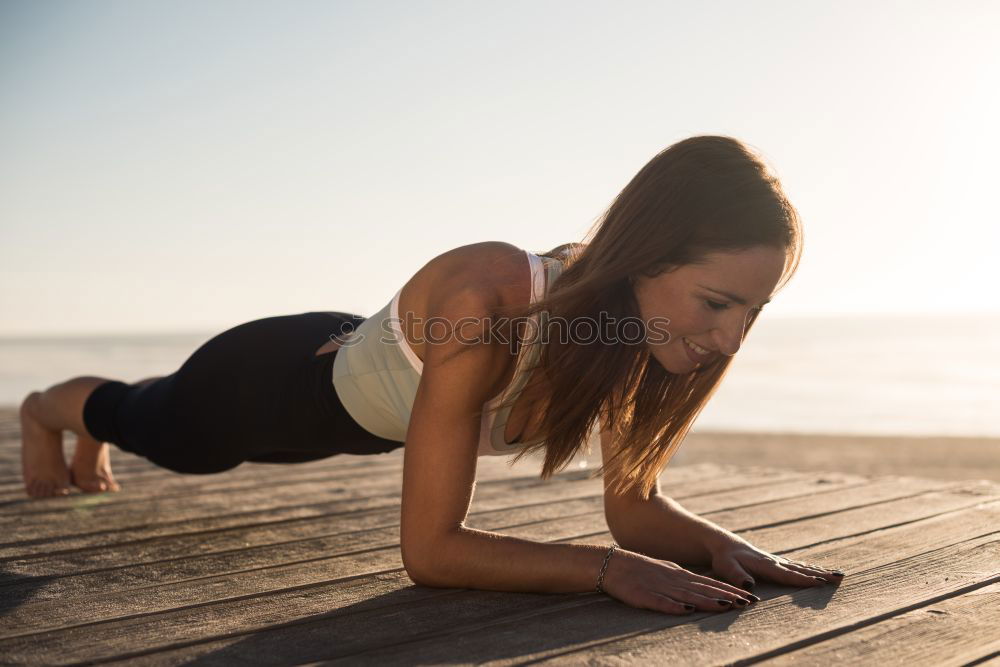 Similar – Black fit woman doing pushups on urban floor.