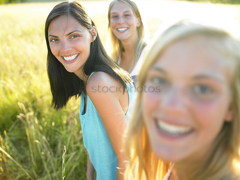 Similar – Beautiful women taking a selfie portrait in the park.