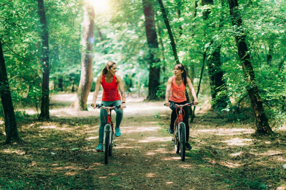 Similar – Image, Stock Photo Women with bikes taking a selfie