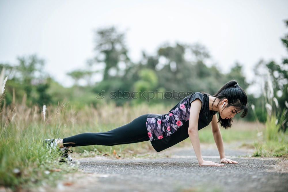 Similar – Young black woman doing stretching after running outdoors