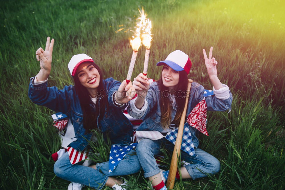 Teenage girls holding USA flag outdoor