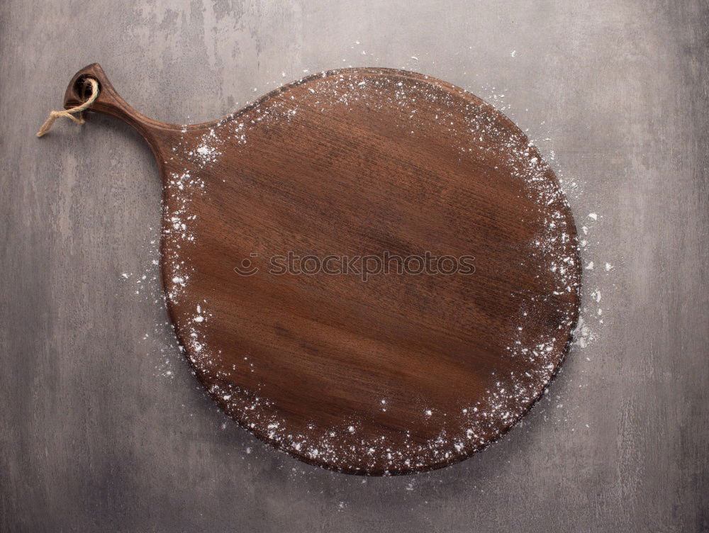 Similar – cast iron pan with a spatula on a gray textile napkin