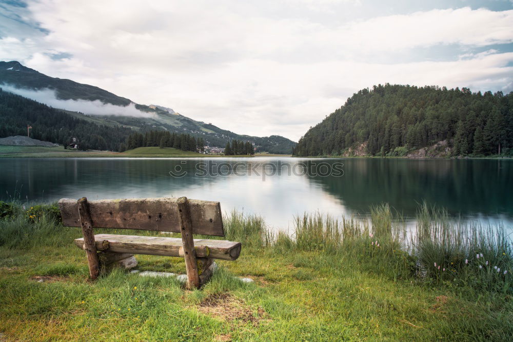 Similar – Mountain lake, woman standing