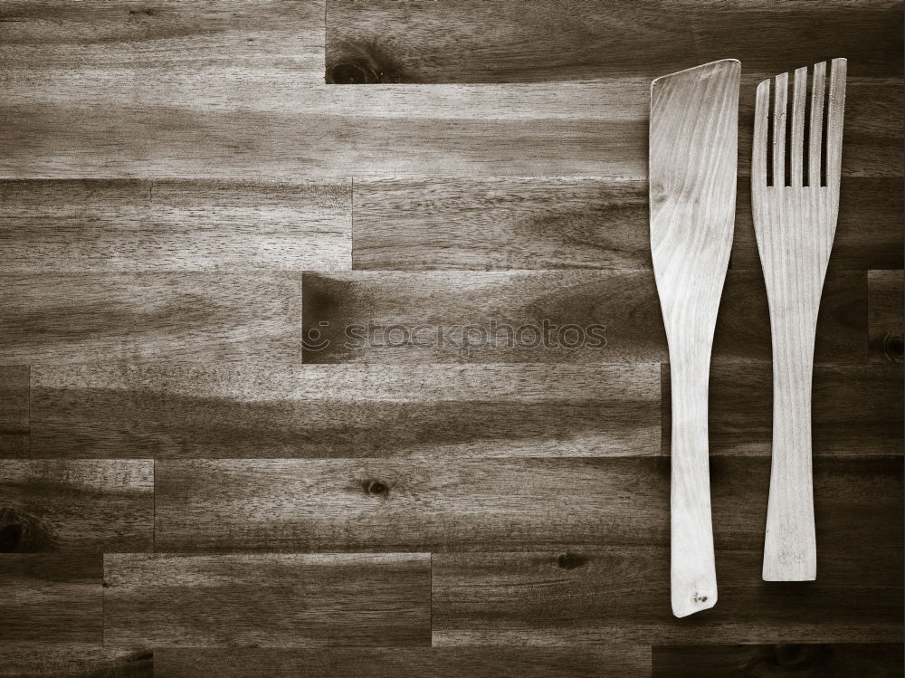 Similar – cutlery on the gray wooden surface