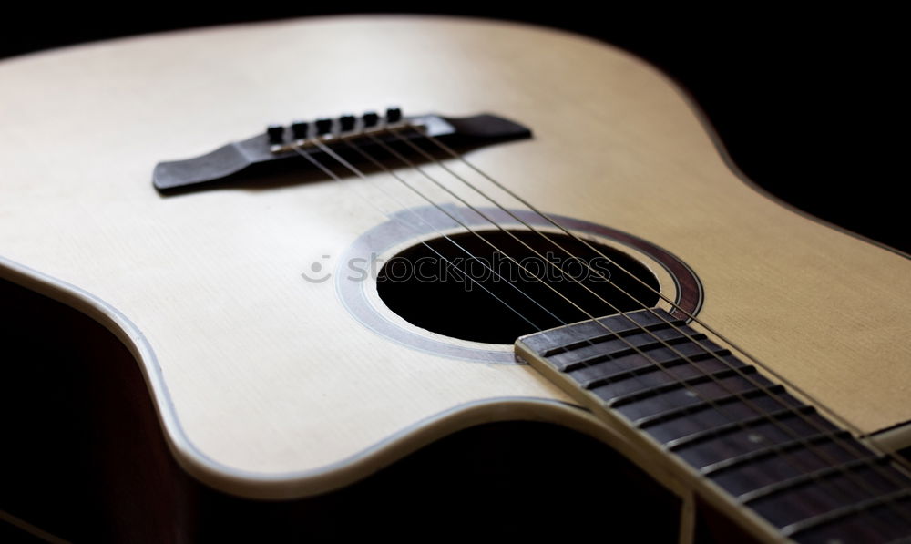 Similar – Young man playing acoustic guitar