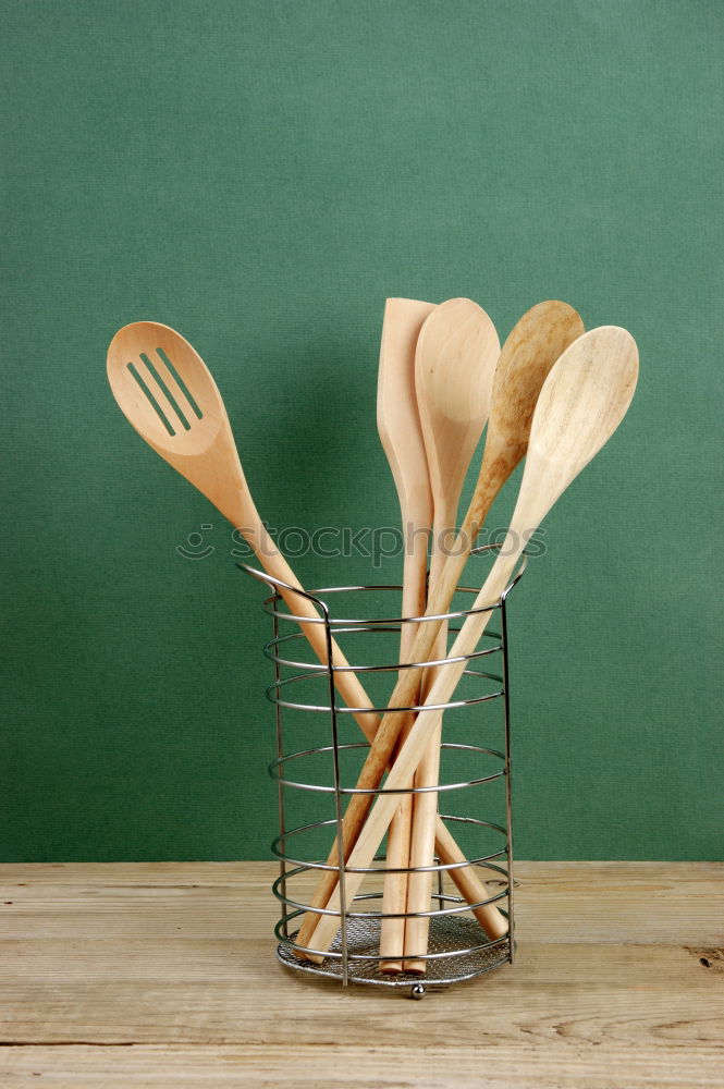 Similar – Black cast-iron frying pan with a wooden spatula