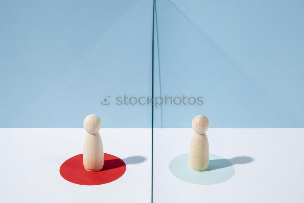 Similar – Image, Stock Photo Two white game pieces on a black background are facing two black game pieces on a white background