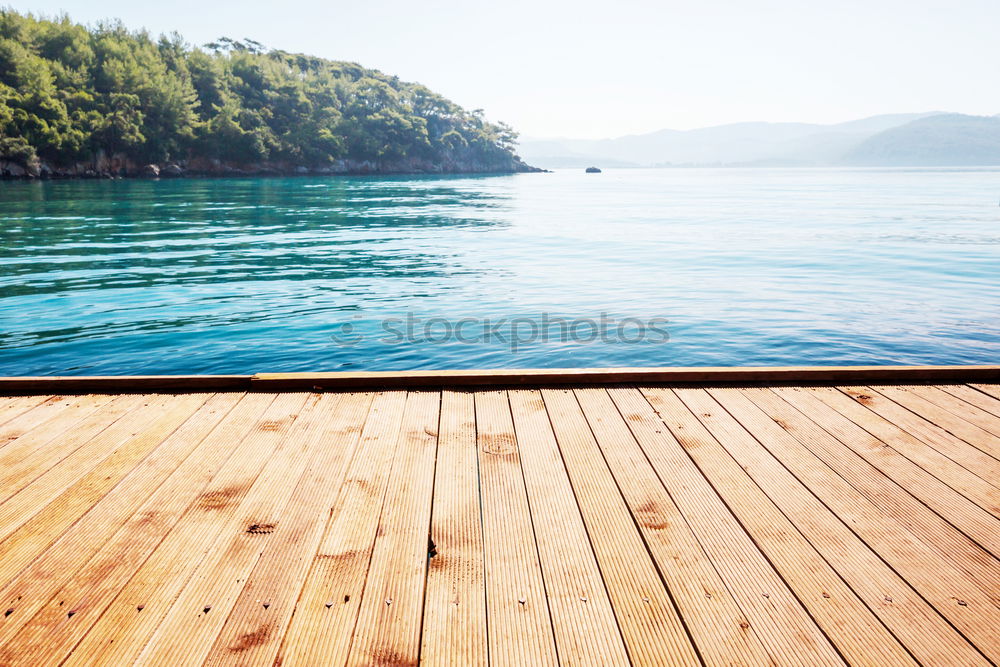 Similar – Image, Stock Photo Woman looking at hills on lake