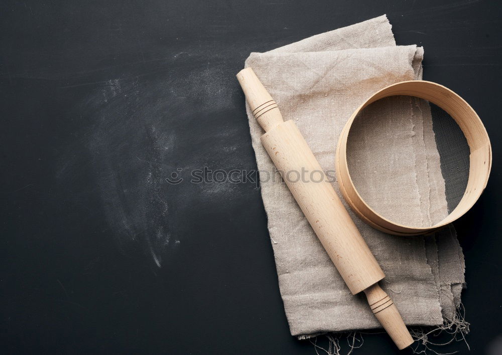 Similar – Black cast-iron frying pan with a wooden spatula