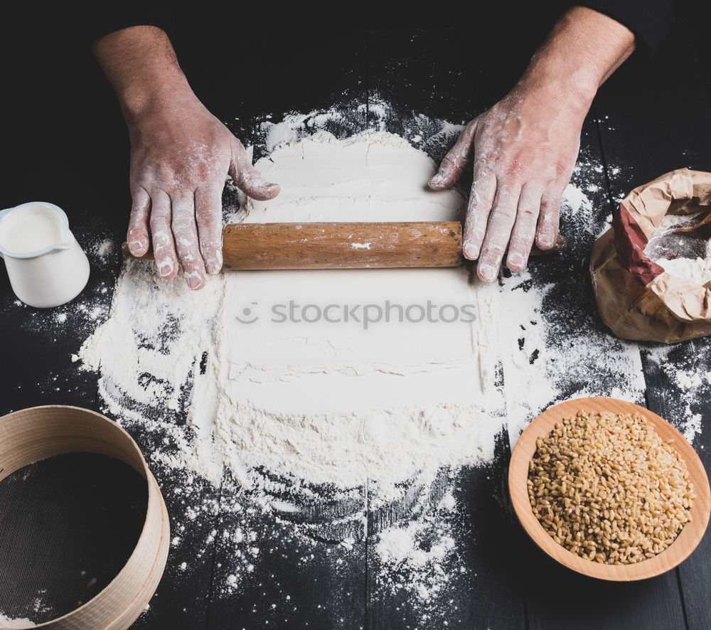 Similar – Image, Stock Photo male hand holding a ceramic plate with yeast dough
