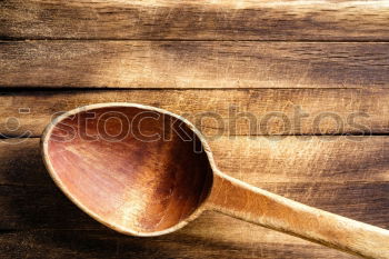 old brown wooden spoon and cutting board