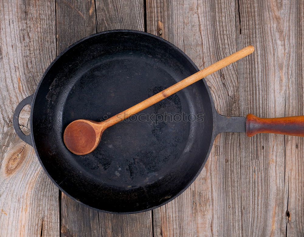 Empty black cast-iron frying pan