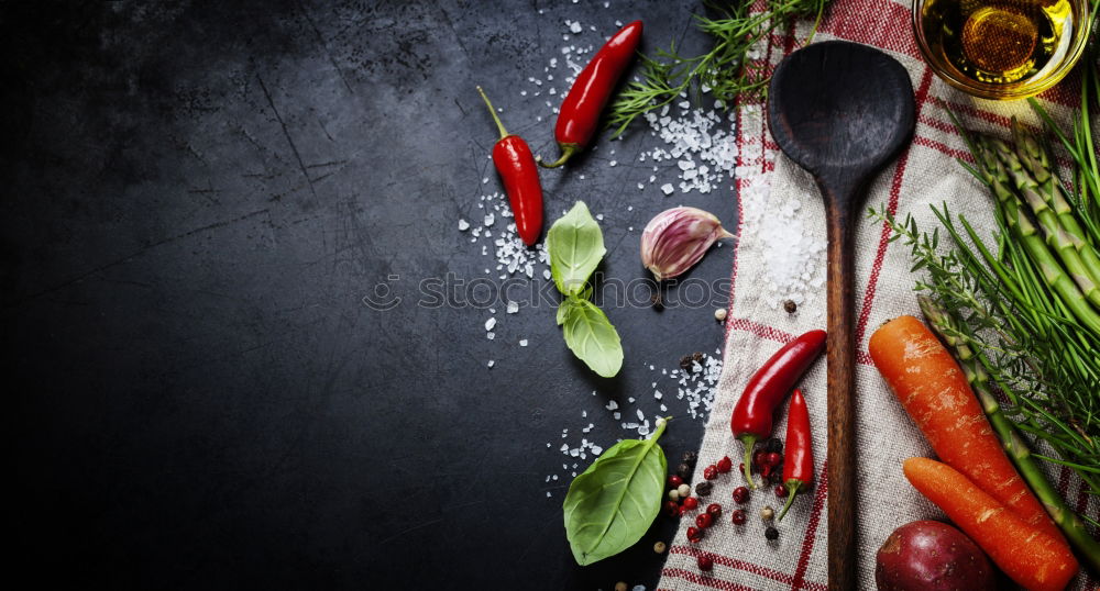 Similar – Spoon and fork on the plate framed with spices