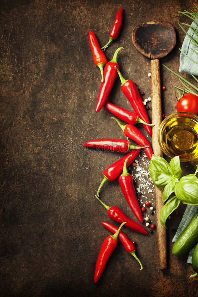 Similar – Rosemary, chopped chili and salt, wood background