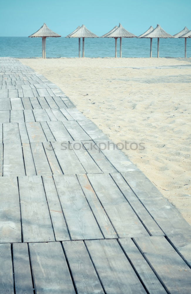 Similar – Image, Stock Photo Terrace and cyclists on the beach