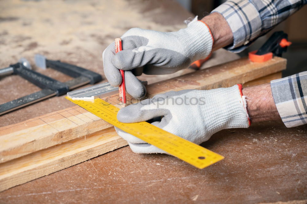 Similar – Image, Stock Photo Carpenter works with a chisel and a hammer.