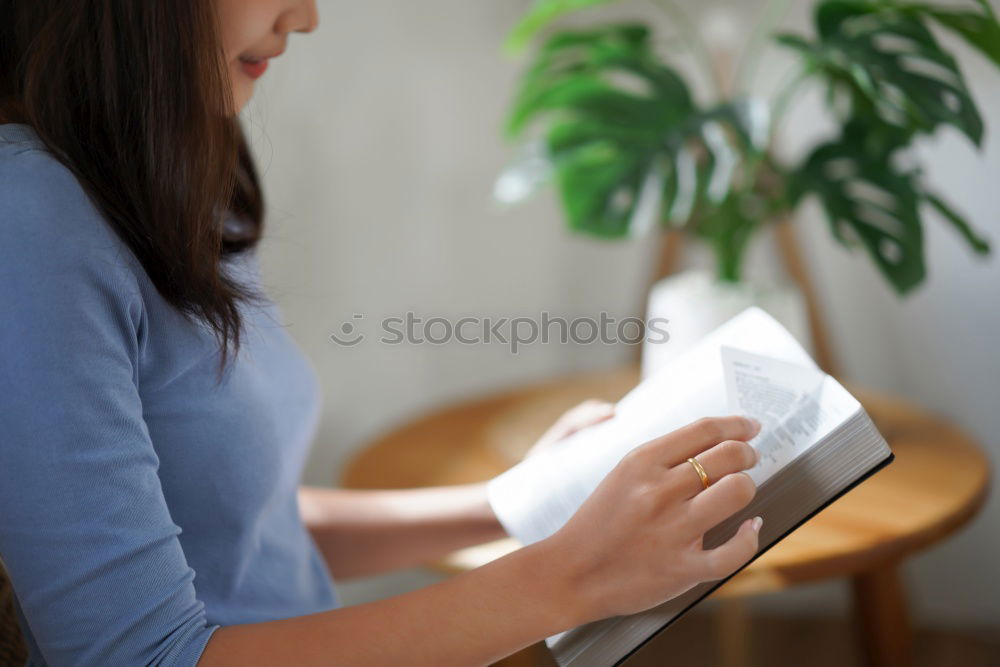 Similar – Young woman sitting on floor with notepad