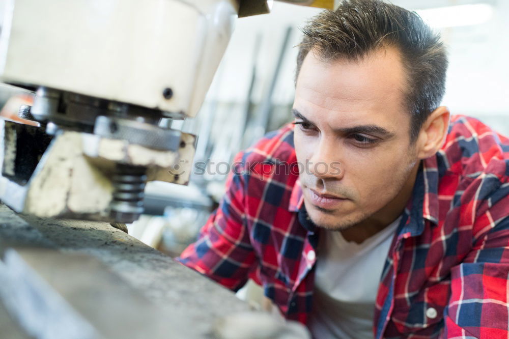 Similar – Professional Mechanic Repairing Car.