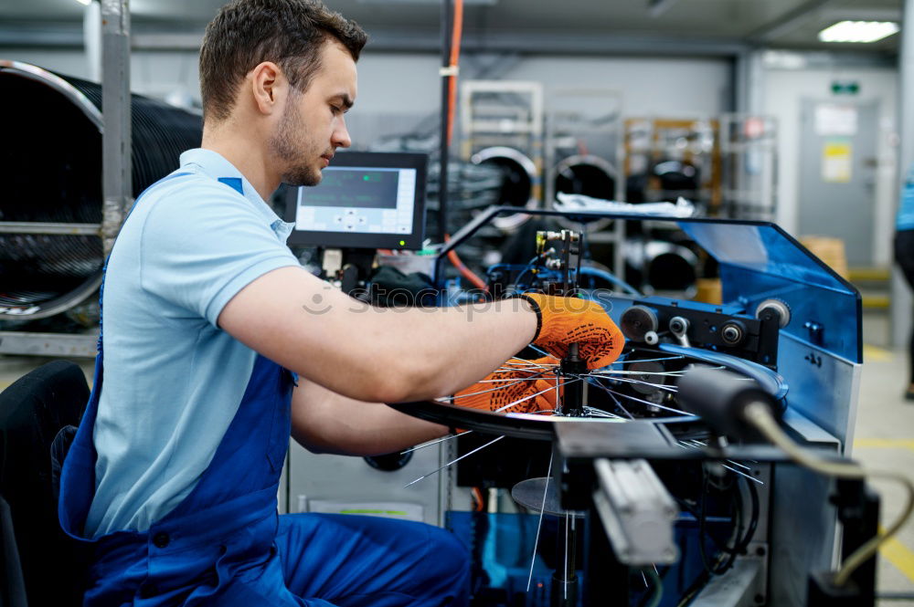 Similar – Professional Mechanic Repairing Car.