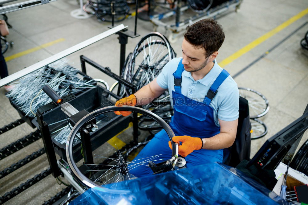 Similar – Professional Mechanic Repairing Car.