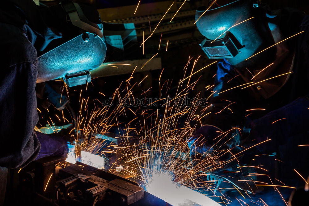 Similar – worker using an angle grinder