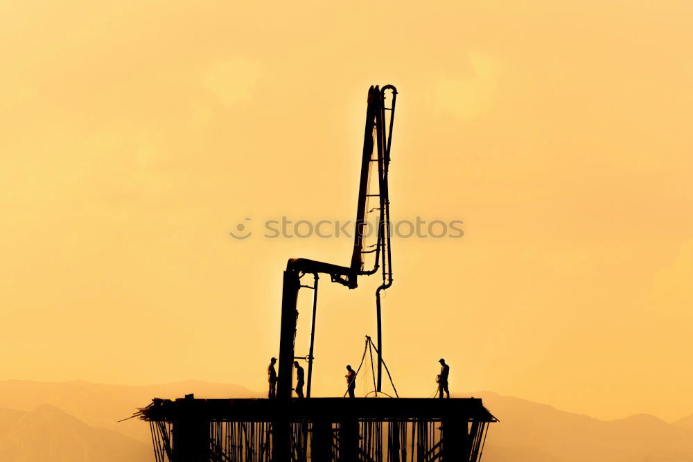 Similar – Truck cranes on rails in the orange evening sky