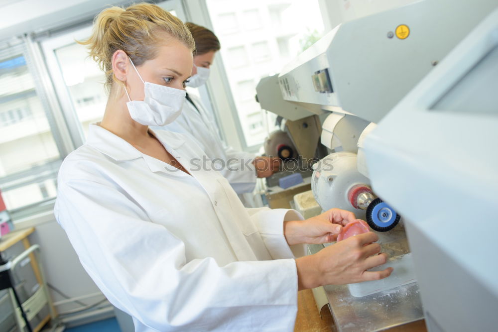 Similar – Worker putting liquid to test tube