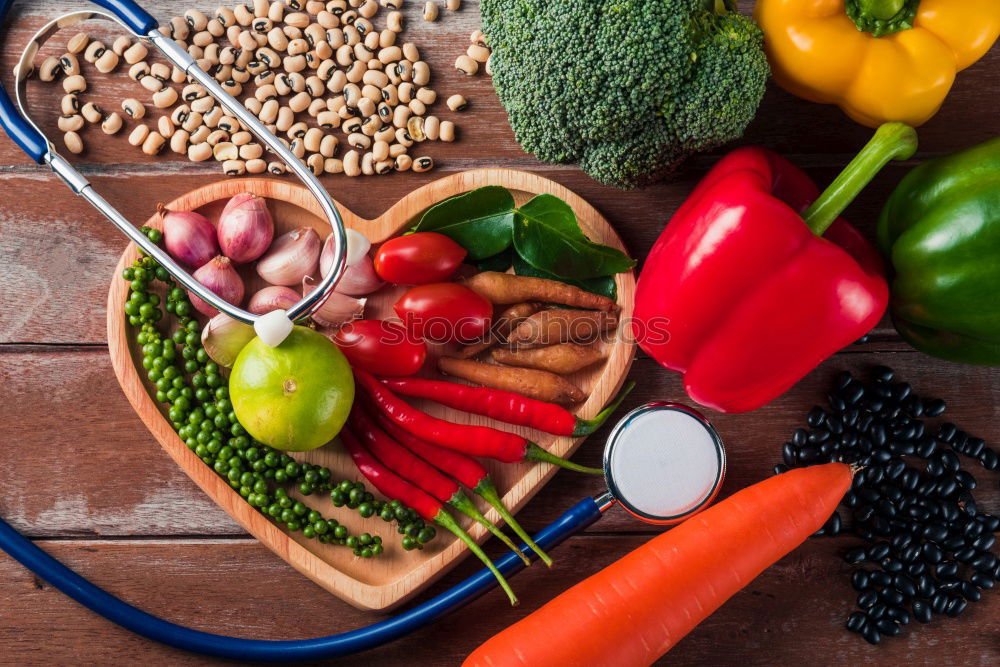 Similar – Vegetables and utensils on kitchen table