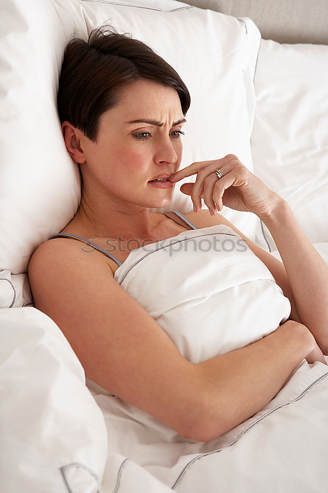 Similar – Portrait of a beautiful adult woman lying on a bed