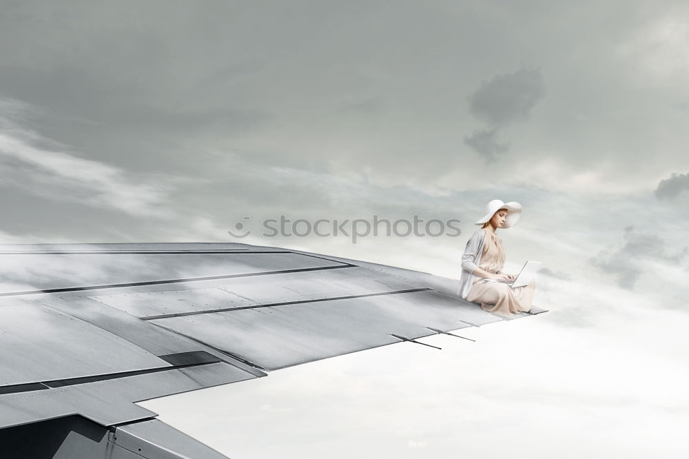 Portrait of a young woman dancing barefoot in a glass greenhouse