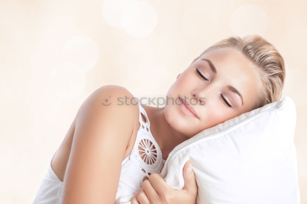 Similar – Image, Stock Photo A young smiling beautiful girl is lying in bed in the bedroom. The girl stretches in the morning after waking up. Side view, space for text