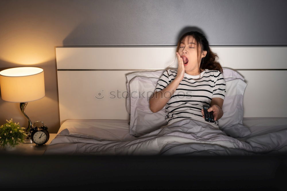 Similar – Cheerful woman lying with book