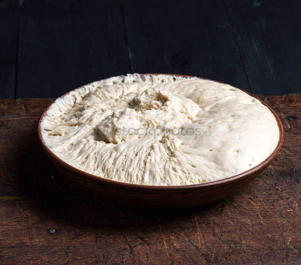 Similar – Meringue with cracks in old bowls