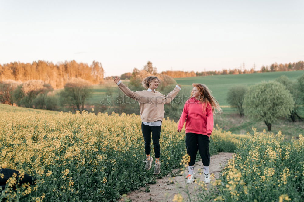 Similar – Lesbian couple with child in park